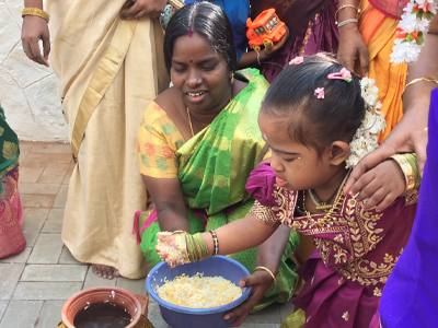 Pongal  being cooked by the children with help